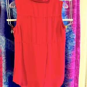 button up sleeveless shirt. Very comfortable and hangs nicely.